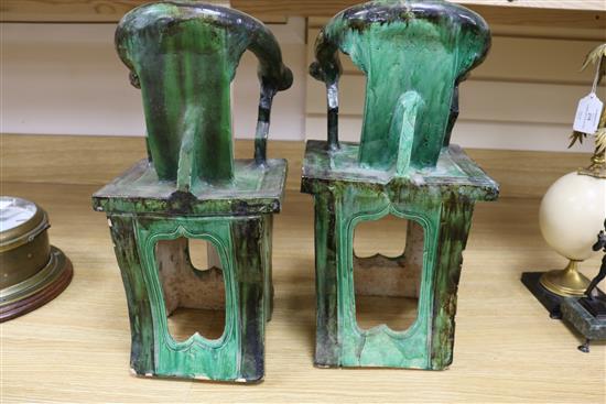 A near pair of Chinese sancai pottery models of horseshoe backed chairs, Ming dynasty, 41cm and 42cm